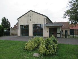 Façade arrière de la salle communale de Beugny